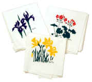 Brilliant daffodils, geraniums and iris decorate these 100% cotton tea towels.